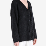 Black jacket worn by a person, showing the jacket fit