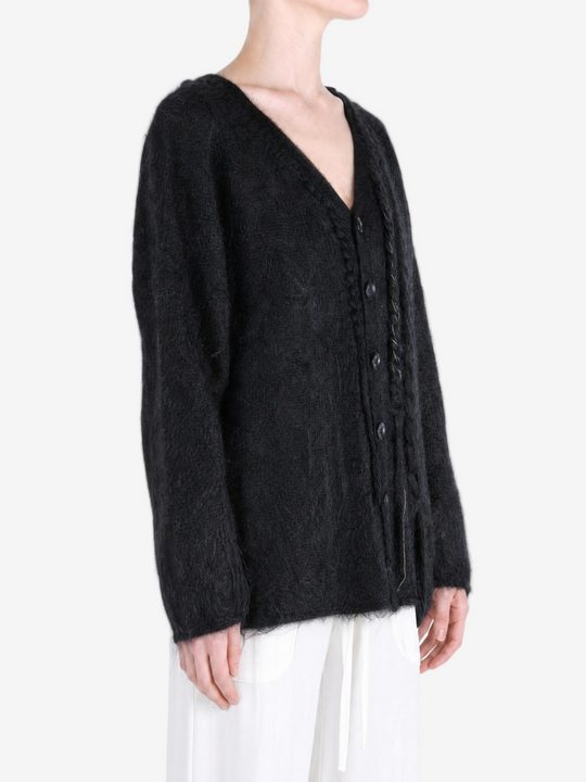 Black jacket worn by a person, showing the jacket fit