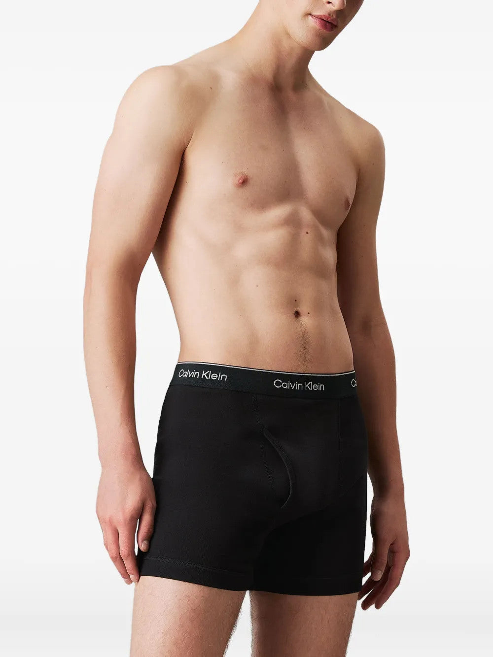 Black shorts worn by a person, showing the shorts fit