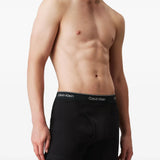 Black shorts worn by a person, showing the shorts fit