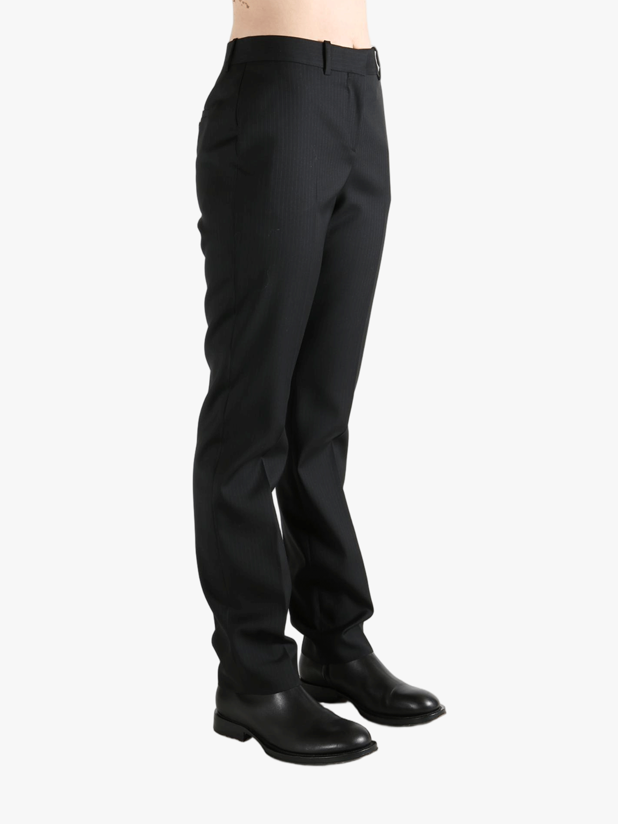 Grey pant worn by a person, showing the pant's fit