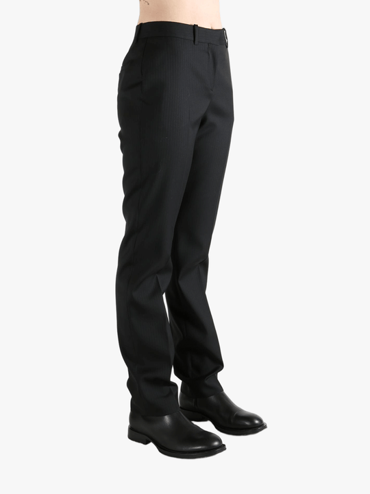 Grey pant worn by a person, showing the pant's fit