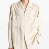 White shirts worn by a person, showing the shirts fit