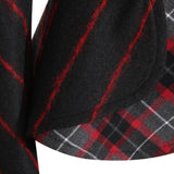 Close up of Black jacket, showing texture of the 98% virgin wool/ 2% elastane made in fabric