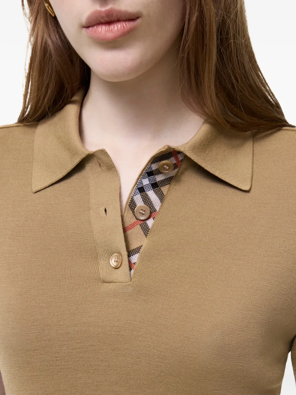 Tan shirt worn by a person, showing the shirt fit