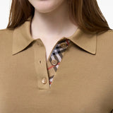 Tan shirt worn by a person, showing the shirt fit