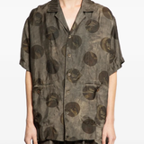 Grey shirt worn by a person, showing the shirt's fit