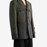 Green jacket worn by a person, showing the jacket fit
