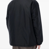 Black jackets worn by a person, showing the jackets fit