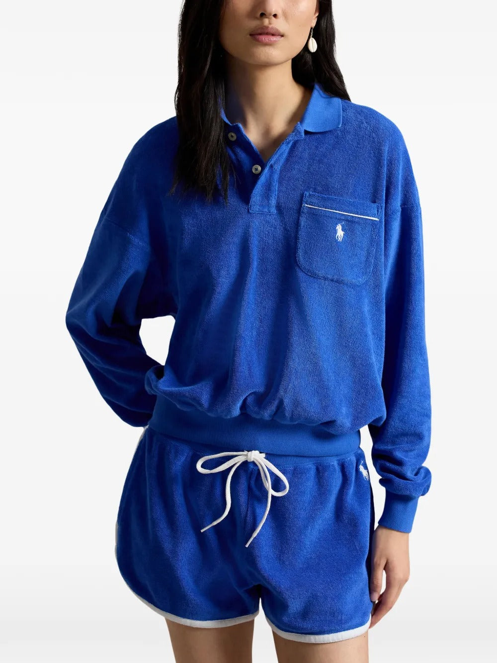 Blue top worn by a person, showing the top's fit