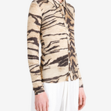 Tan shirt worn by a person, showing the shirt fit