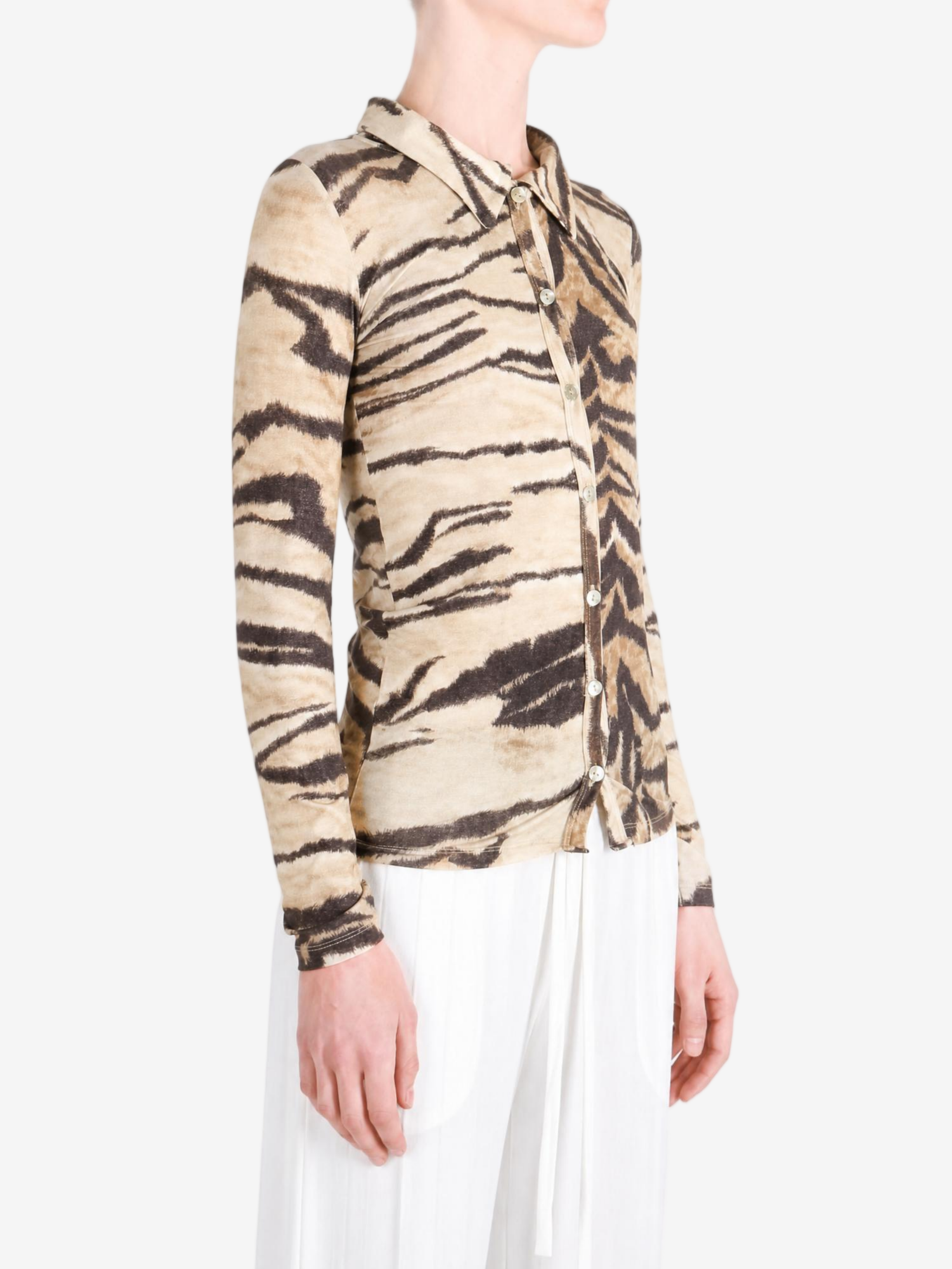 Tan shirt worn by a person, showing the shirt fit