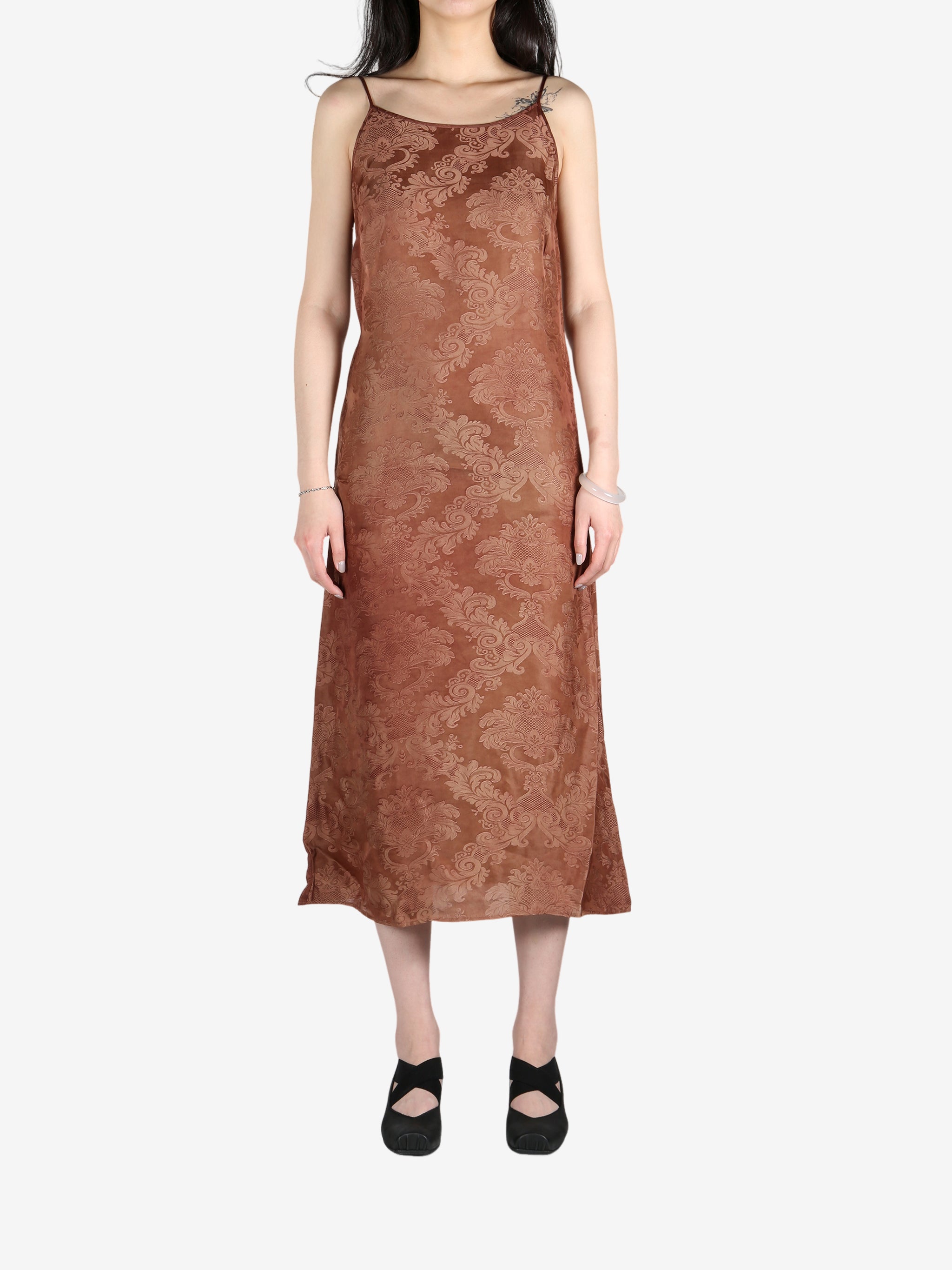Brown dress worn by a person, showing the dress's fit