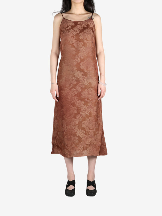 Brown dress worn by a person, showing the dress's fit