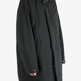 Black coat worn by a person, showing the coat fit