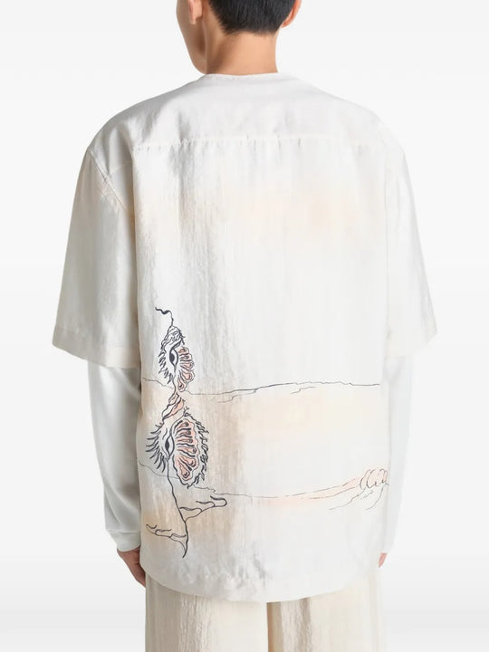 White tops worn by a person, showing the tops fit