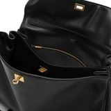 Close up of black bag, showing texture of the leather fabric