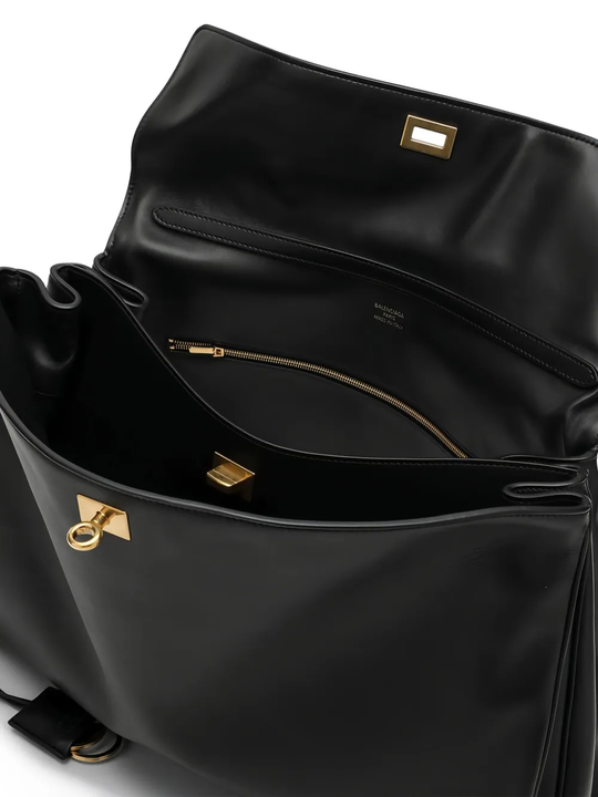 Close up of black bag, showing texture of the leather fabric