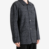 Grey jacket worn by a person, showing the jacket fit