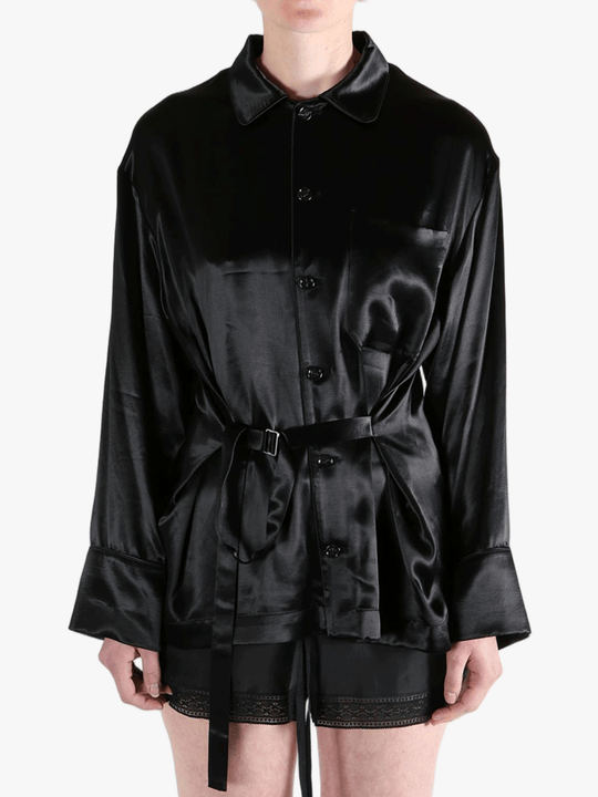 Black top worn by a person, showing the top's fit