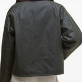 Green jacket worn by a person, showing the jacket fit
