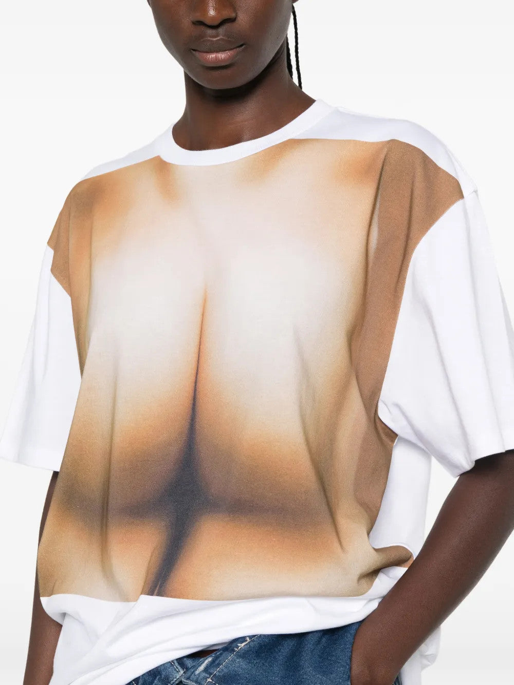 White t-shirt worn by a person, showing the t-shirt fit