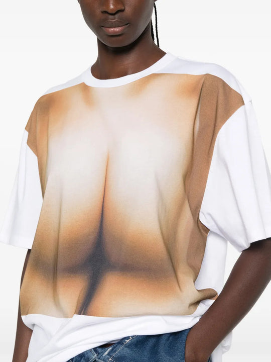 White t-shirt worn by a person, showing the t-shirt fit