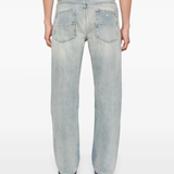 Blue jeans worn by a person, showing the jeans' fit