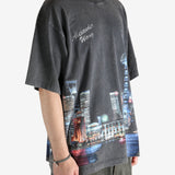 Black shirt worn by a person, showing the shirt fit