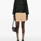 Black jacket worn by a person, showing the jacket's fit