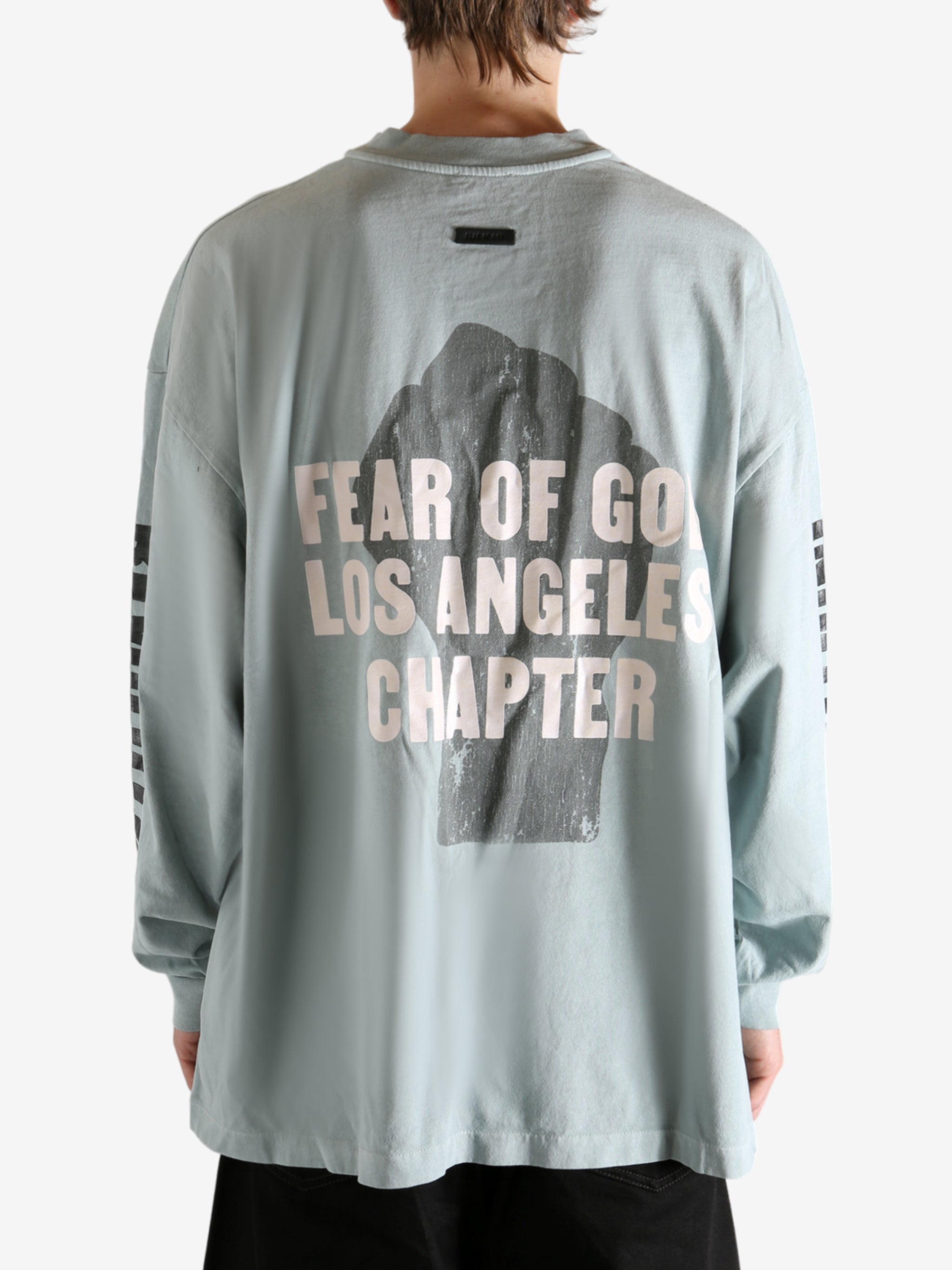 white shirts worn by a person, showing the shirts fit