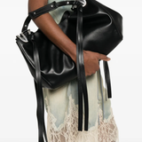 Black bags worn by a person, showing the bags fit