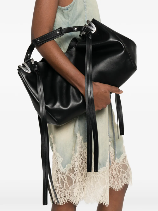 Black bags worn by a person, showing the bags fit