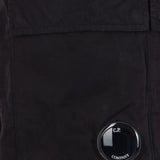 Close up of black pants, showing texture of the cotton fabric