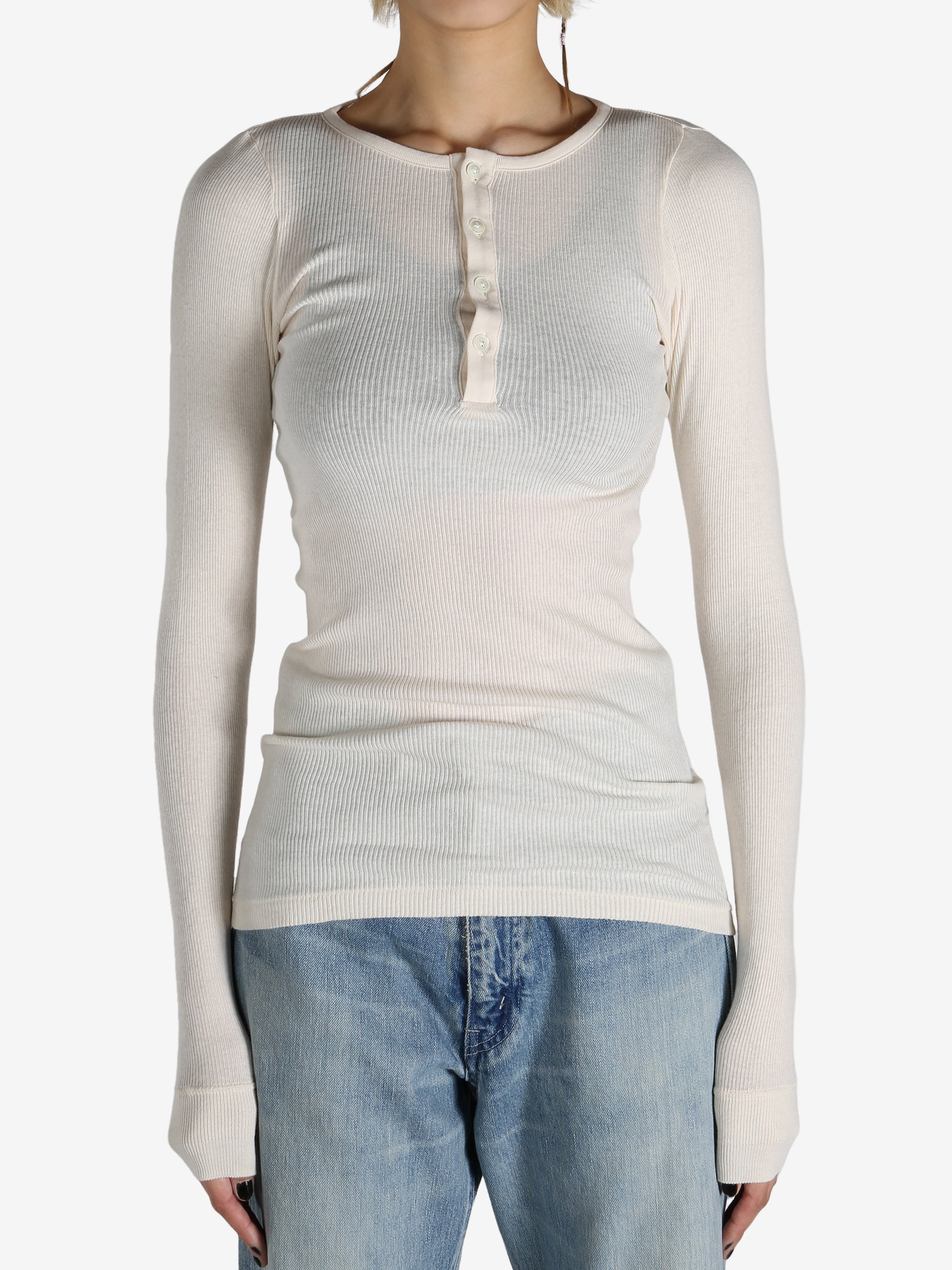 White T-shirt worn by a person, showing the shirt's fit