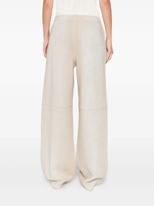 Tan pants worn by a person, showing the pants fit