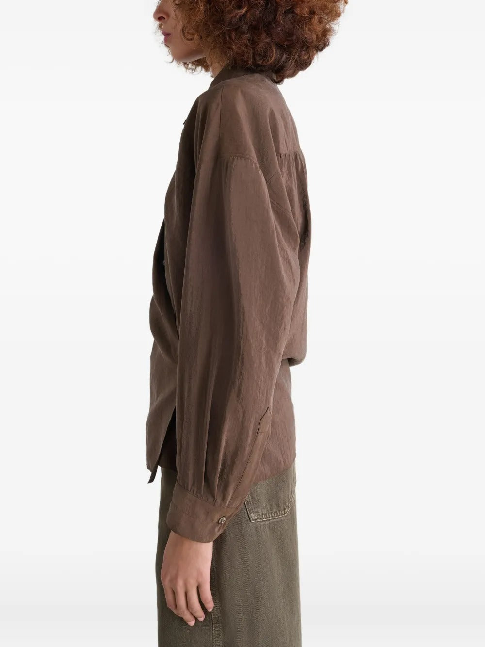 Brown shirt worn by a person, showing the shirt's fit