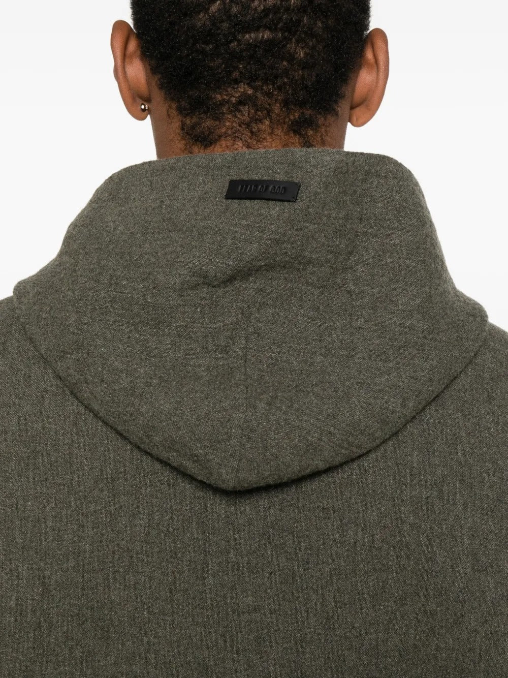 Close up of the black hoodie, showing texture of the wool fabric