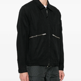 Black coats worn by a person, showing the coats fit