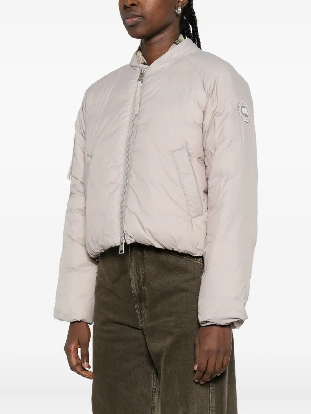 Tan jacket worn by a person, showing the jacket fit