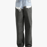 Black jeans worn by a person, showing the jeans fit