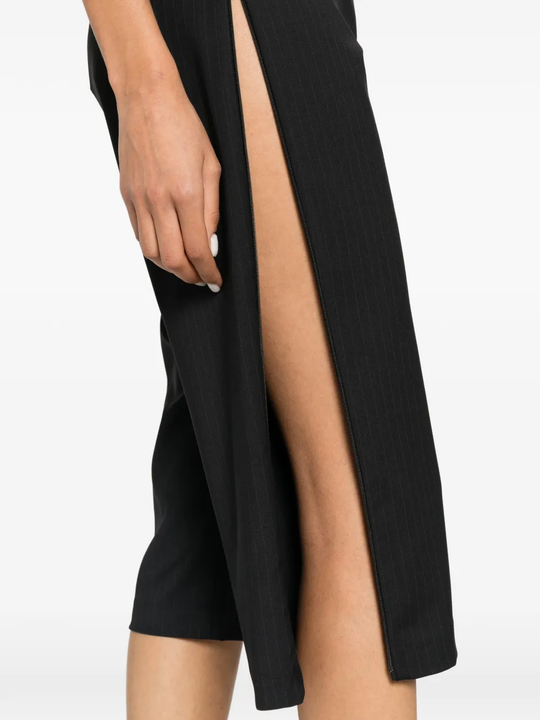 Black pants worn by a person, showing the pants fit