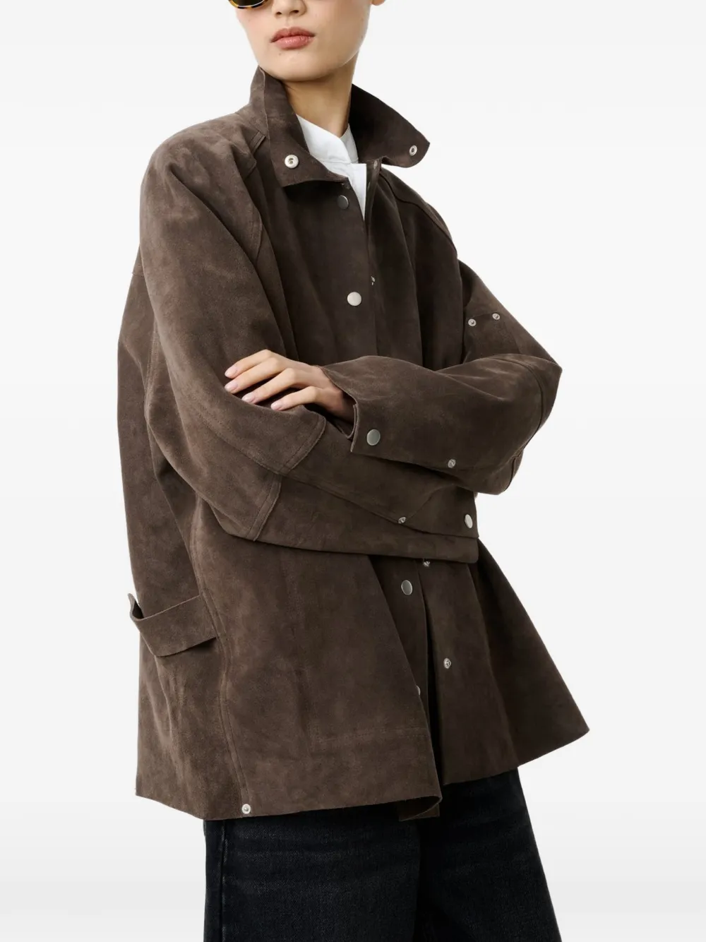 Brown jacket worn by a person, showing the jacket's fit