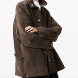 Brown jacket worn by a person, showing the jacket's fit