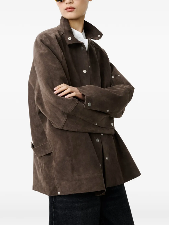 Brown jacket worn by a person, showing the jacket's fit