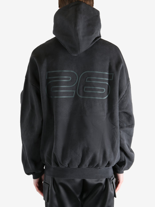 Black hoodie worn by a person, showing the hoodie's fit