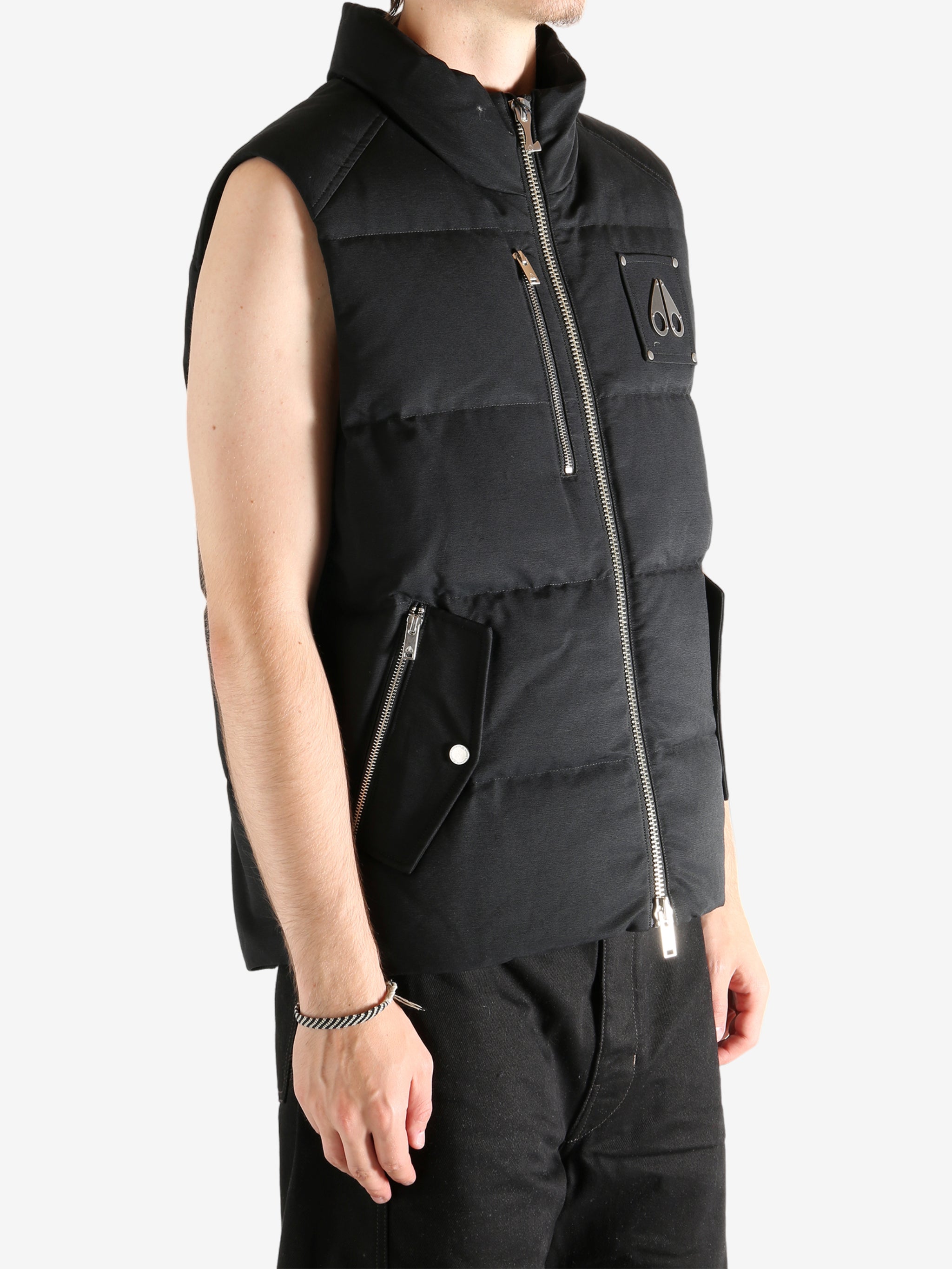 Black vest worn by a person, showing the vest's fit