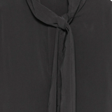 Close up of balck shirt, showing the detail of tie collar