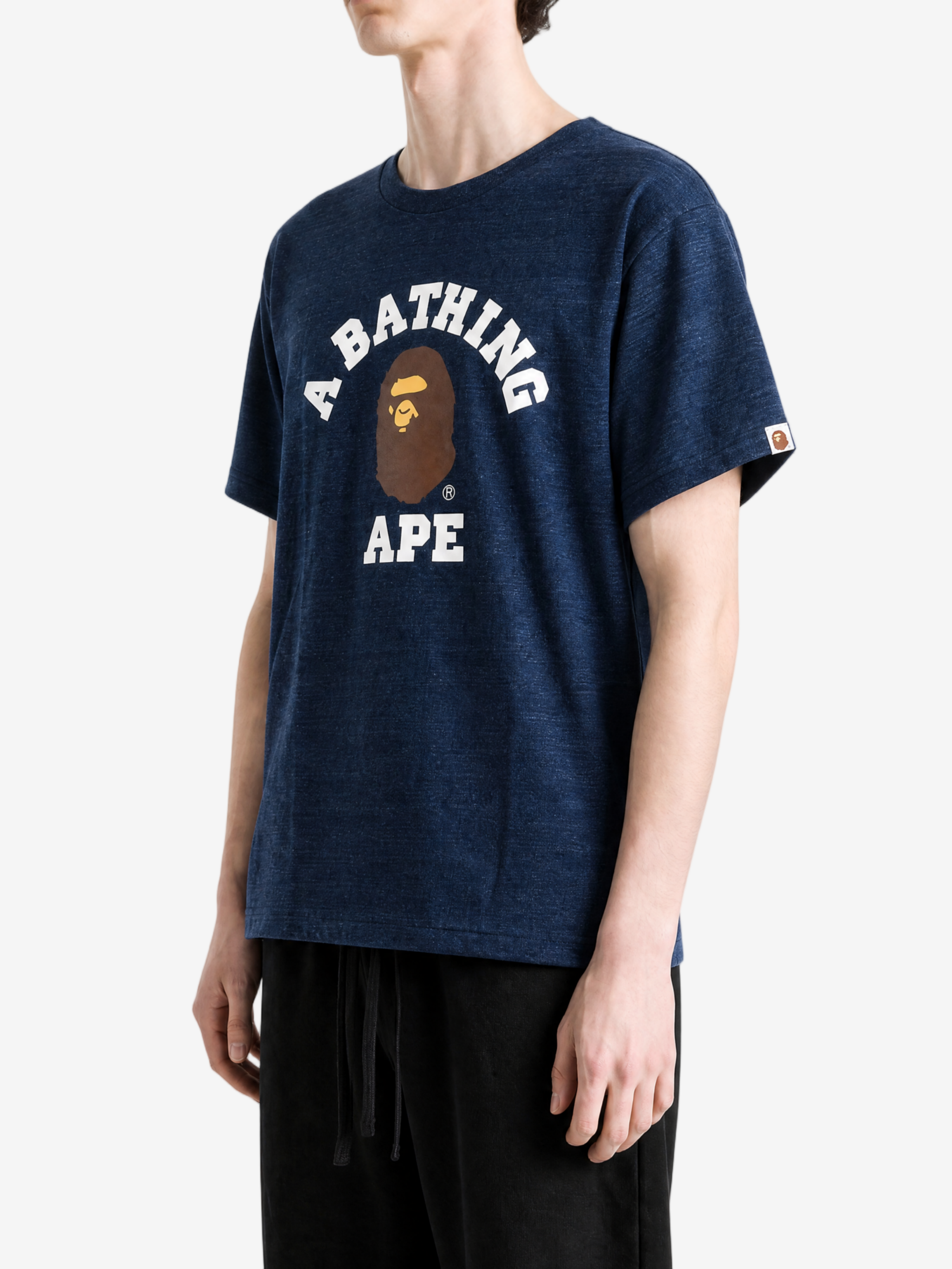 Navy t-shirt worn by a person, showing the t-shirt fit