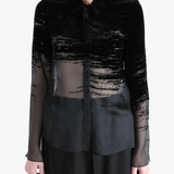 Black shirt worn by a person, showing the shirt fit